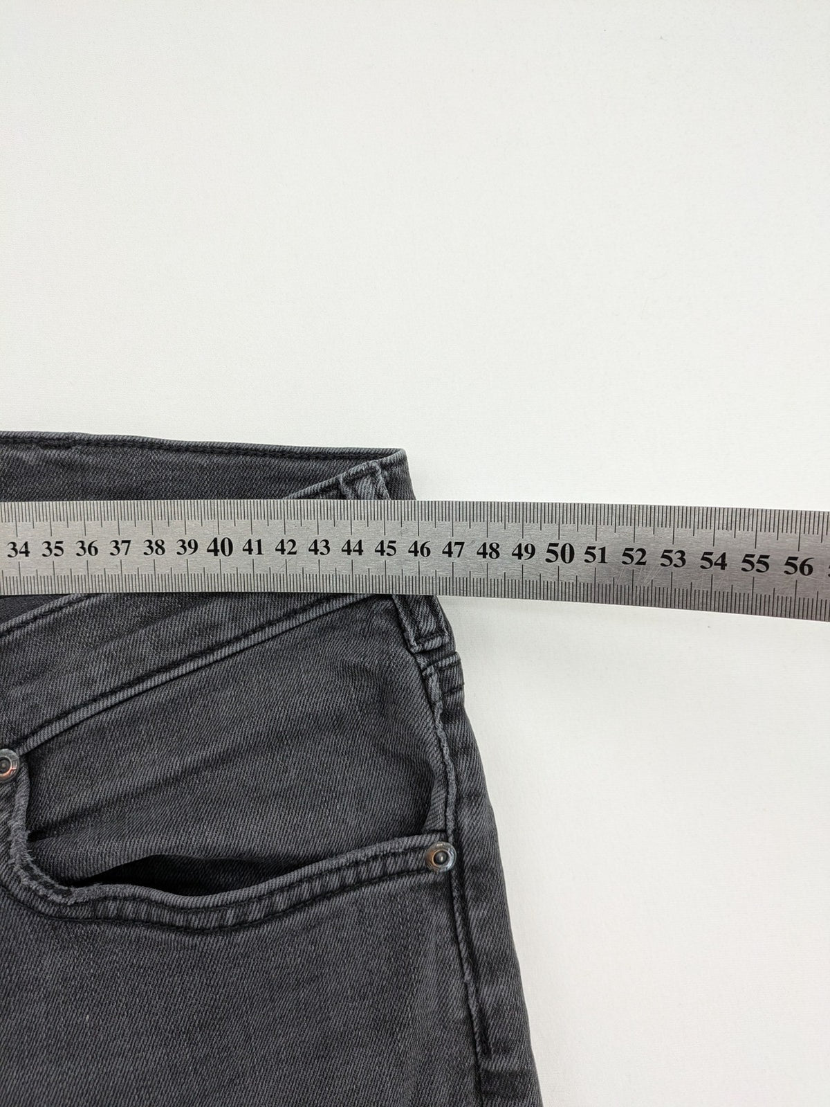 Lee straight jeans grey 5-pocket design with subtle branding on back pocket.