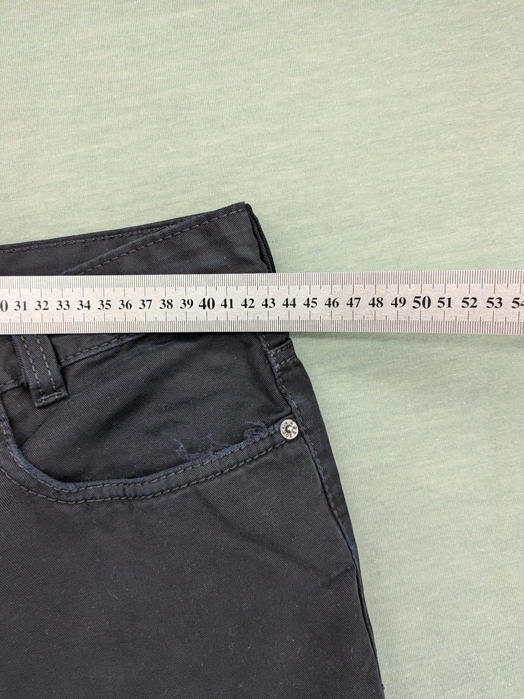 Joker black straight jeans five-pocket design with prominent stitching and brand details.