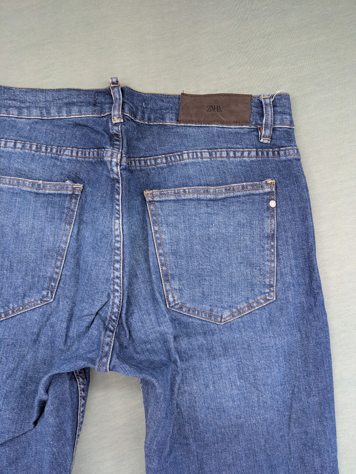 Zara blue straight jeans with medium wash, lightweight denim, and regular fit.