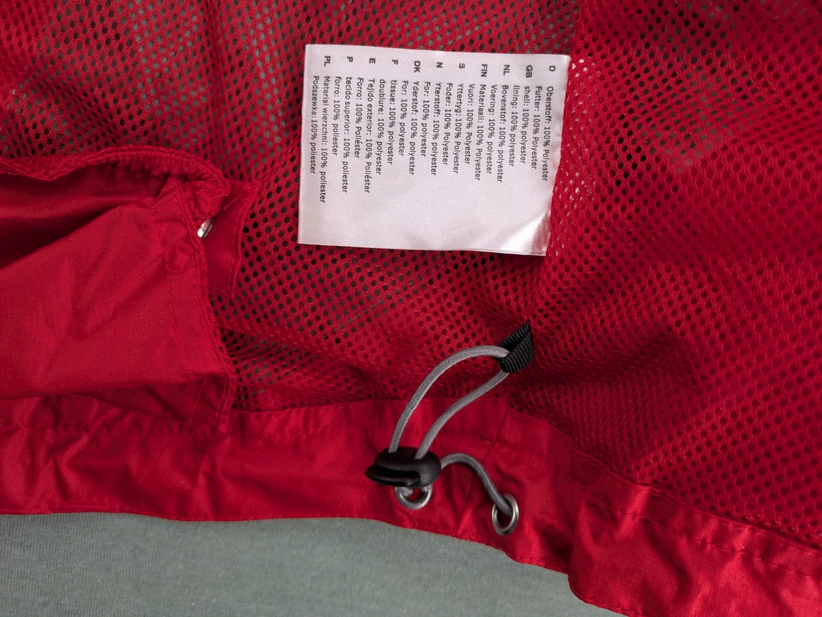 Movement Session grey and red windbreaker jacket with colorblock pattern and full zip.