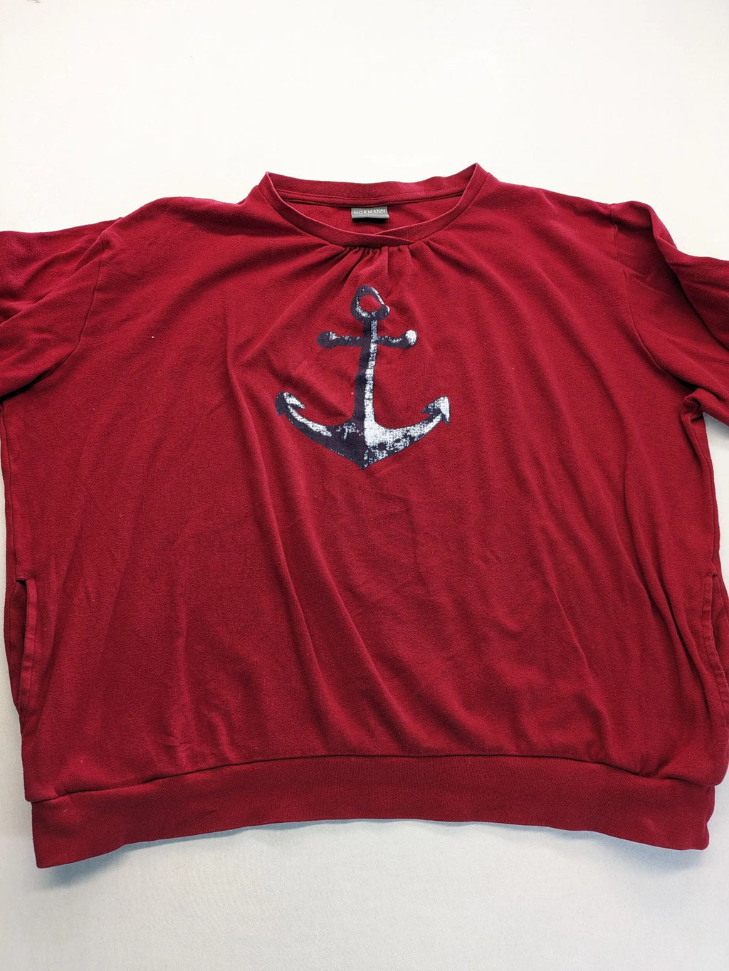 Normann red turtle neck jumper with large anchor print and side pockets.