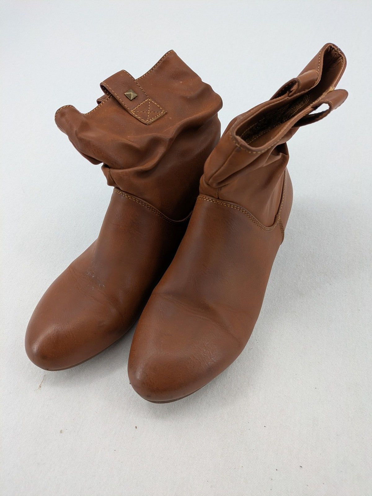 Van Hill brown ankle boots with slouchy design, fold-over cuff, and soft lining.