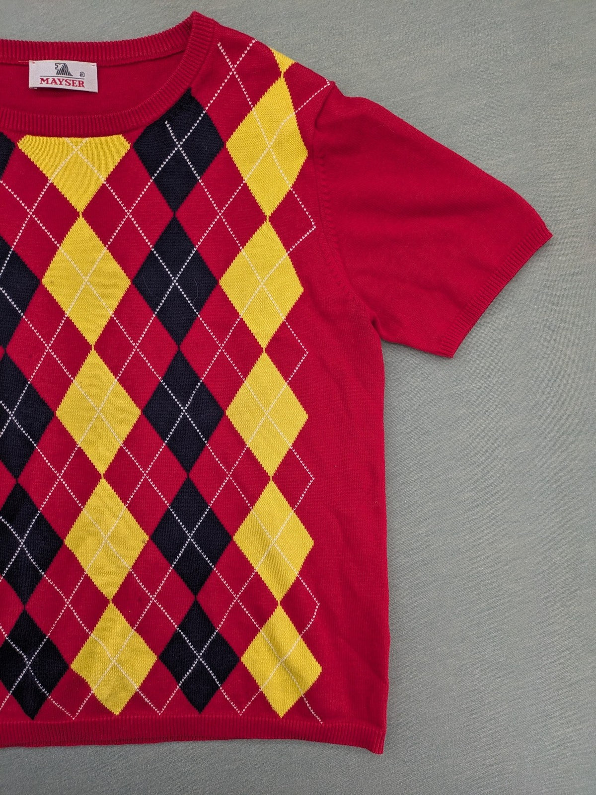 MAYSER multi turtle neck jumper argyle pattern in red, yellow, and black cotton.