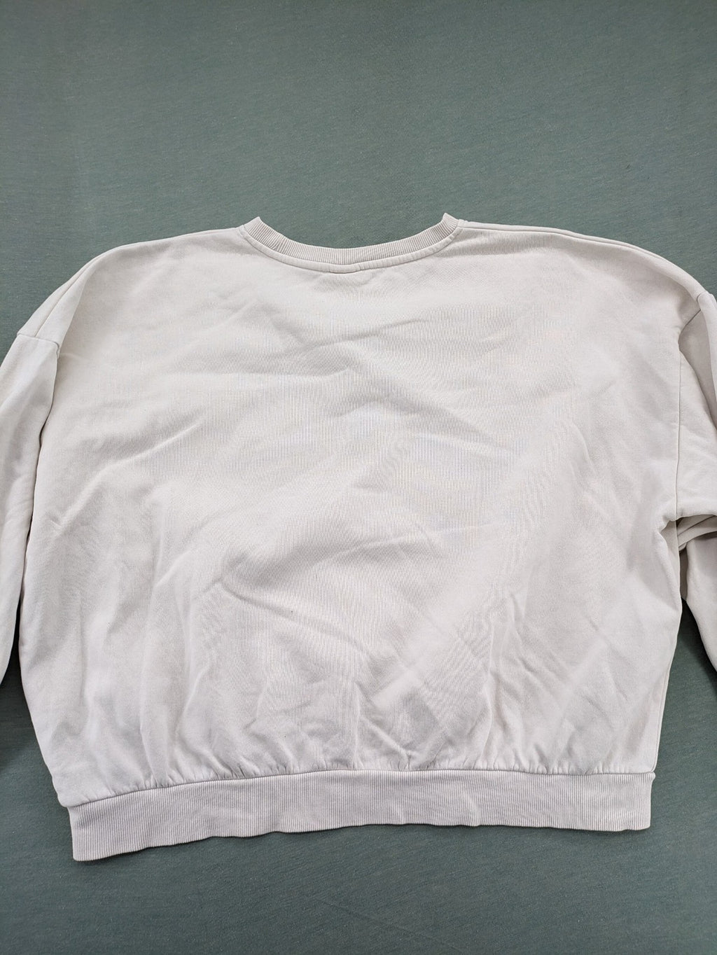 H&M cream turtle neck jumper embroidered Harvard University logo, soft cotton blend.