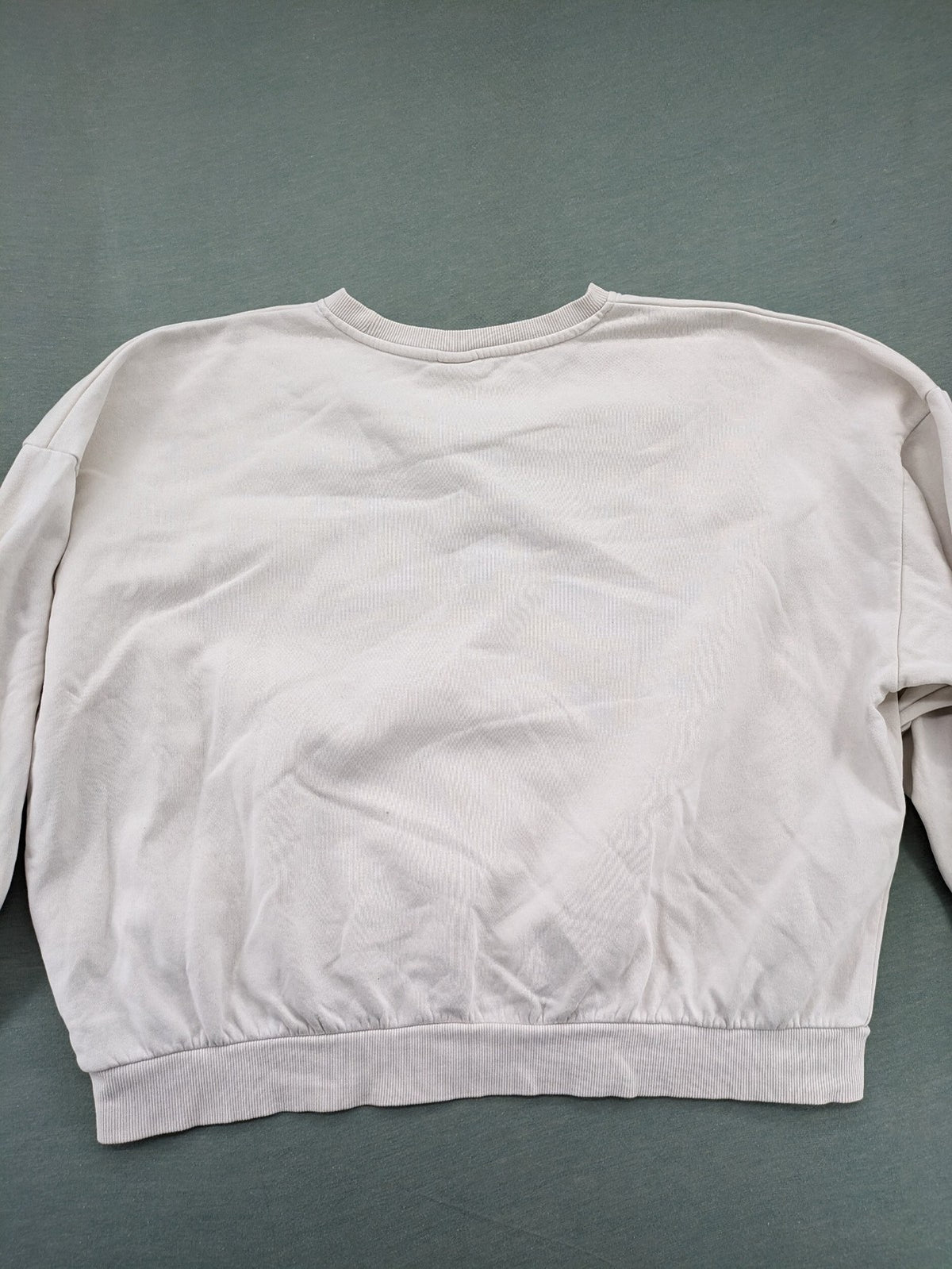 H&M cream turtle neck jumper embroidered Harvard University logo, soft cotton blend.