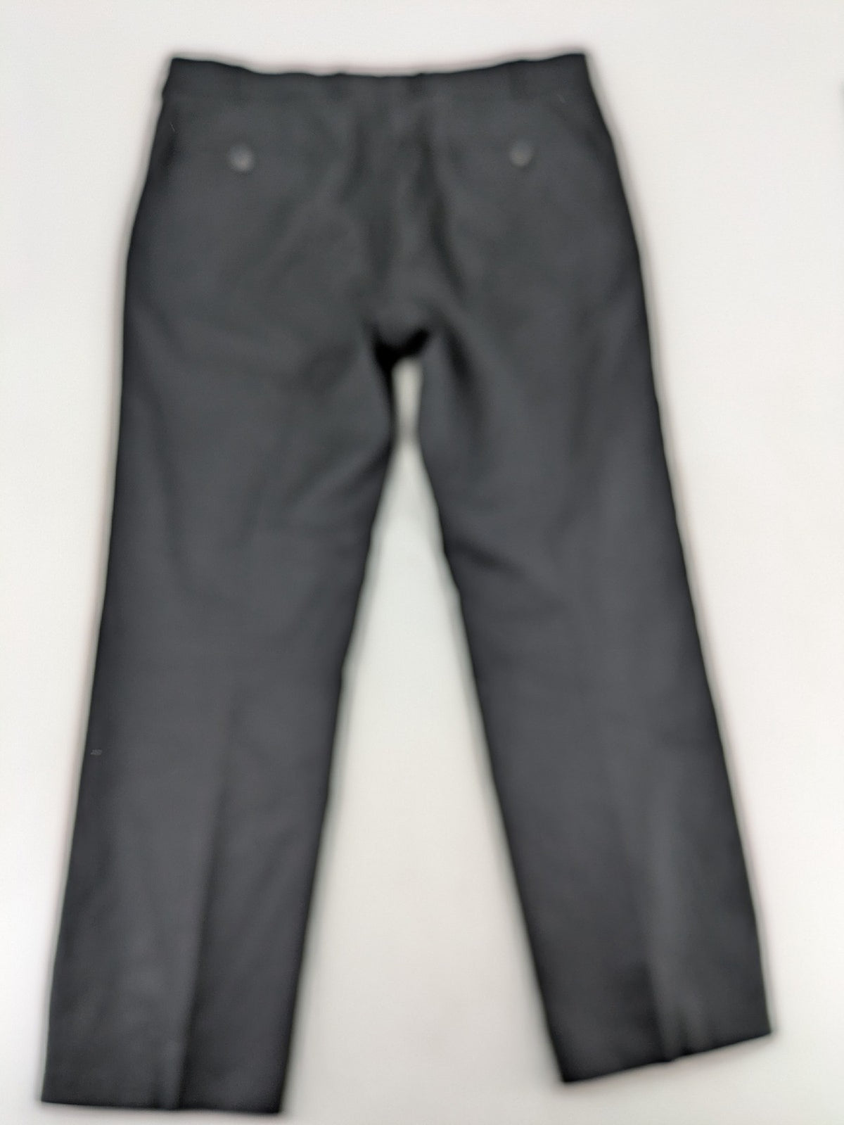 Desch grey suit pants with subtle pinstripe pattern and flat front design.