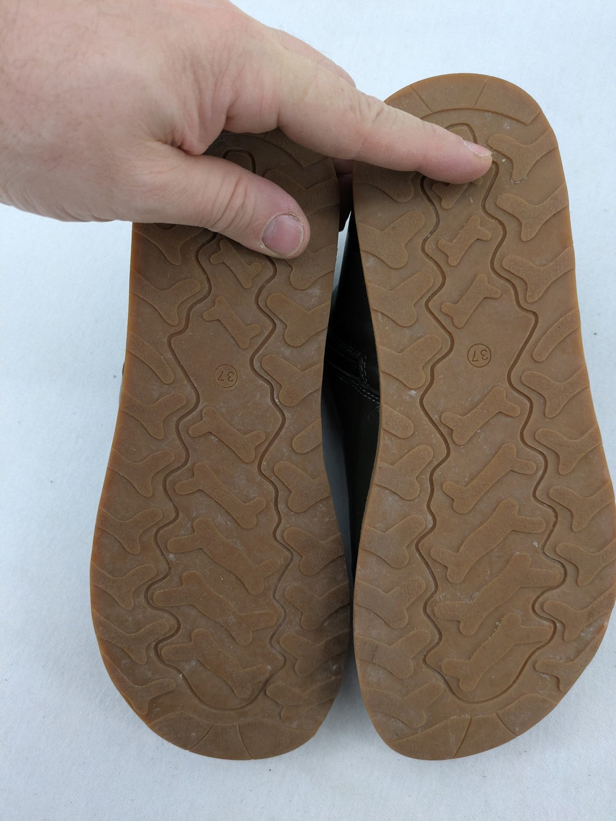 ALS green leather booties with side zipper and decorative stitching.