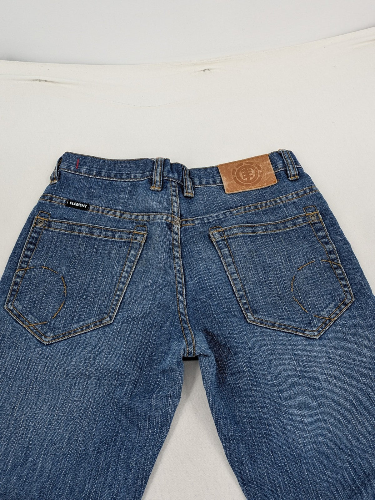 Element blue straight jeans with classic button fly and 5-pocket design.