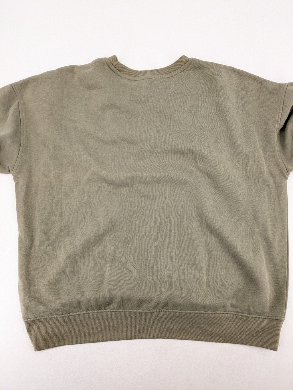 Naruto khaki turtle neck jumper featuring red Akatsuki cloud and Sharingan symbols.