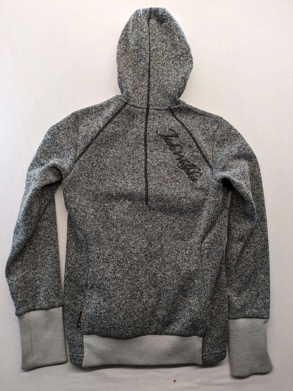 Jack Wolfskin grey fleece jacket with logo detailing and two front pockets.