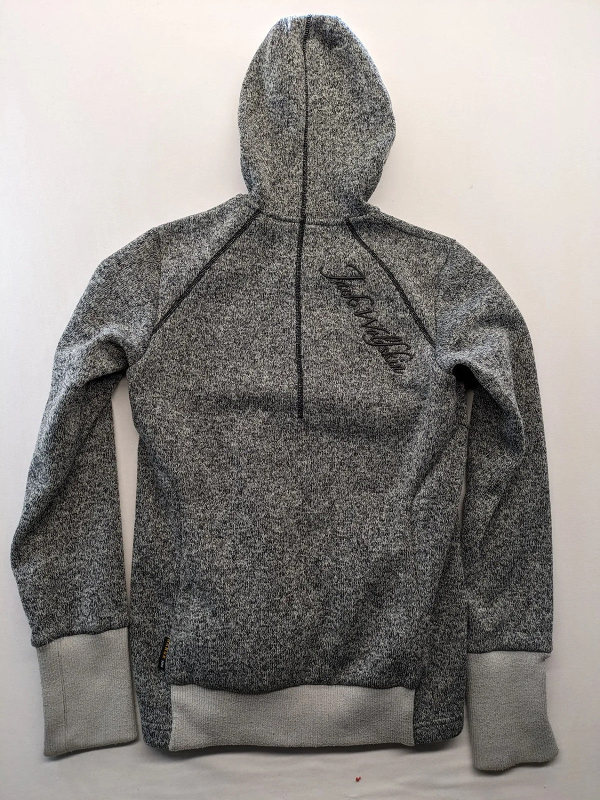 Jack Wolfskin grey fleece jacket with logo detailing and two front pockets.