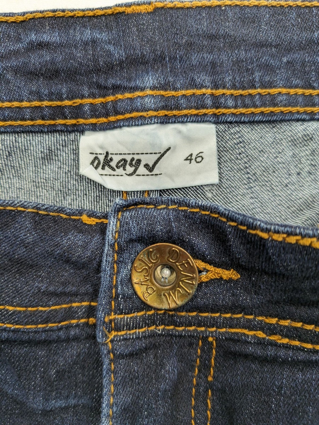 Okay blue straight jeans dark wash 5-pocket style with stretch material for comfort.