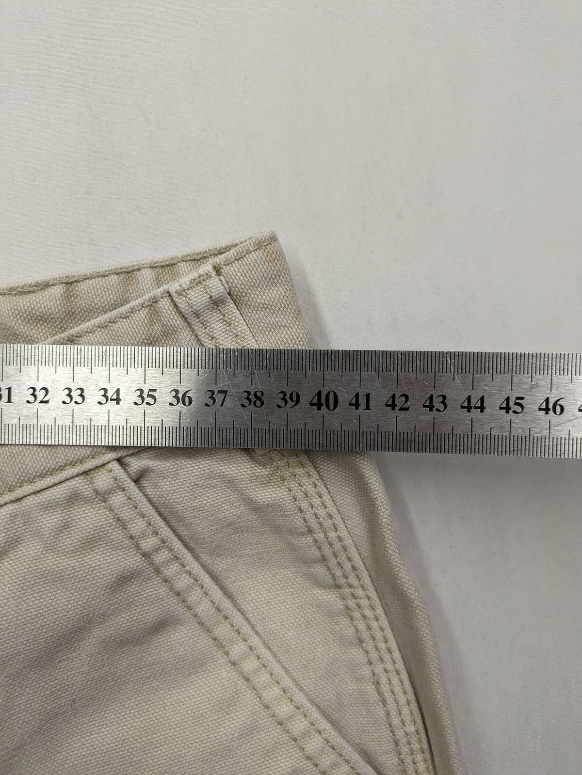 Pull&Bear beige carpenter pants with classic zipper, belt loops, and durable cotton material.