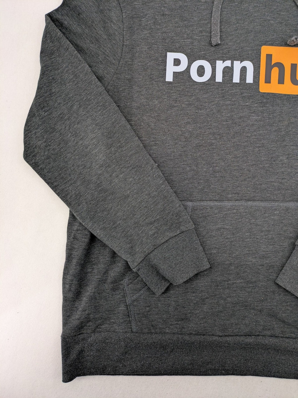 Pornhub grey zip-through hoodie with prominent logo and kangaroo pocket, cotton blend.