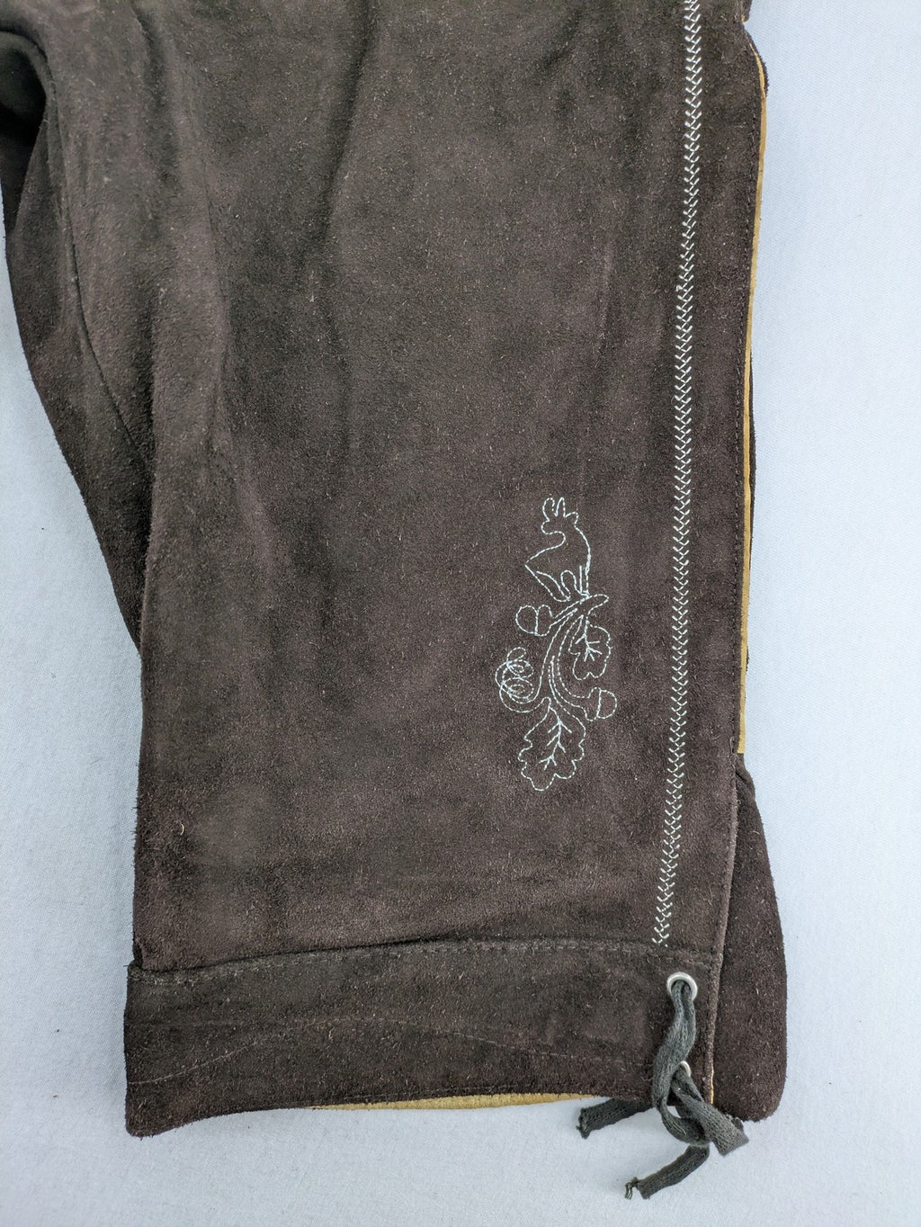 Braun traditional leather pants brown suede with intricate embroidery on bib and legs.