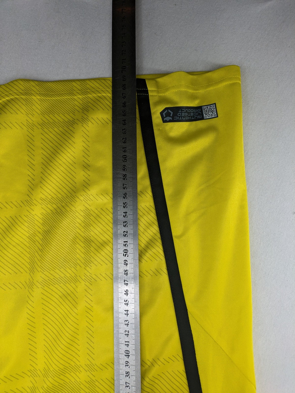 Borussia Dortmund black and yellow soccer uniform with DFB Pokal 2014 patch and Puma logo.