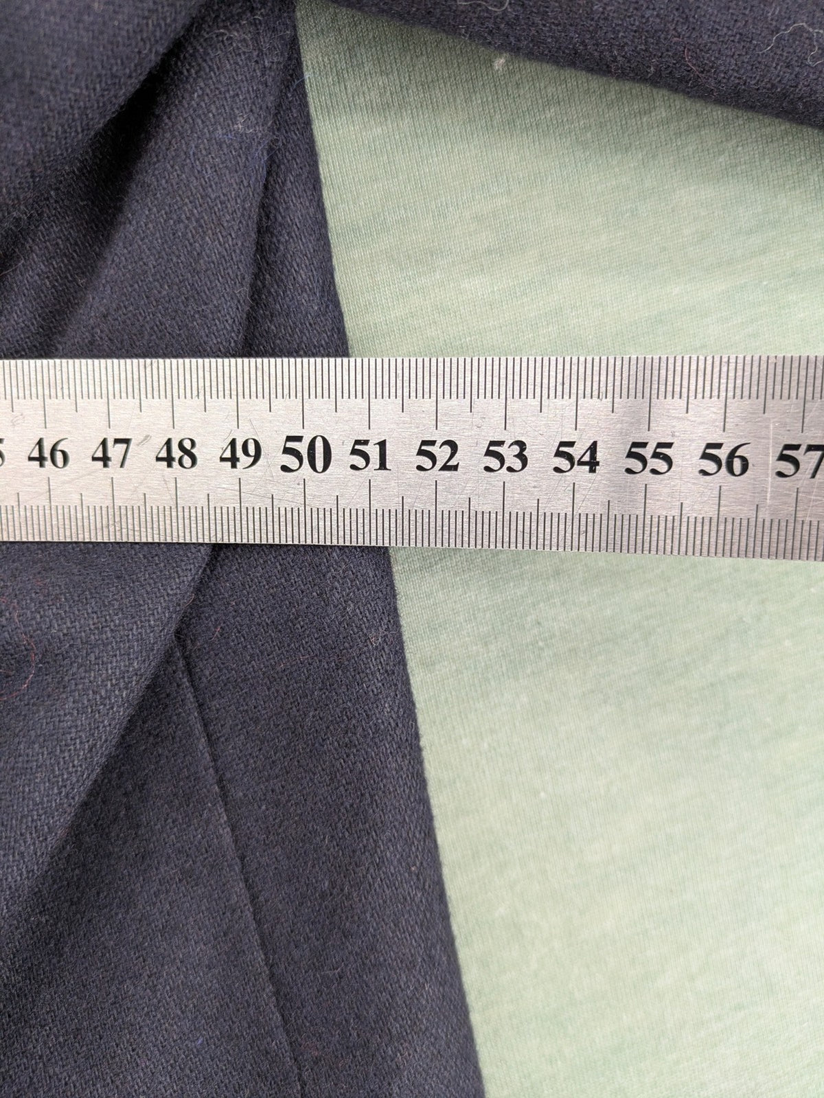 Blazer green and navy jacket with embroidered details and silver buttons.