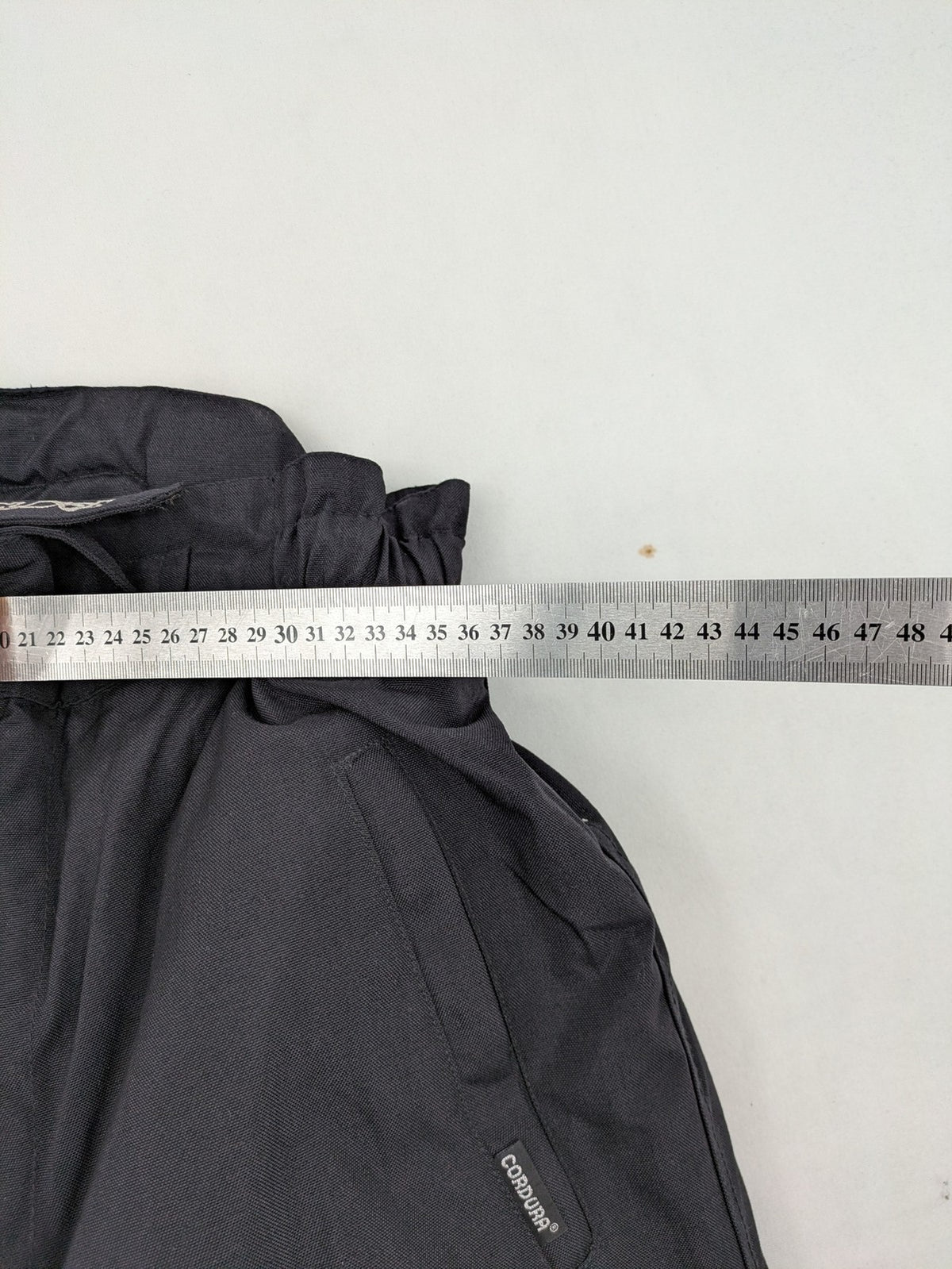 Aero black chaps Cordura fabric with ribbed knee inserts and adjustable waistband.