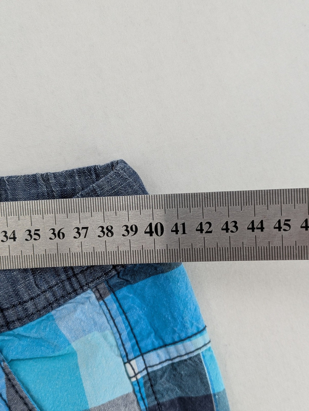 C&A blue checkered shorts with elastic waistband and side pockets, Skate Nation style.