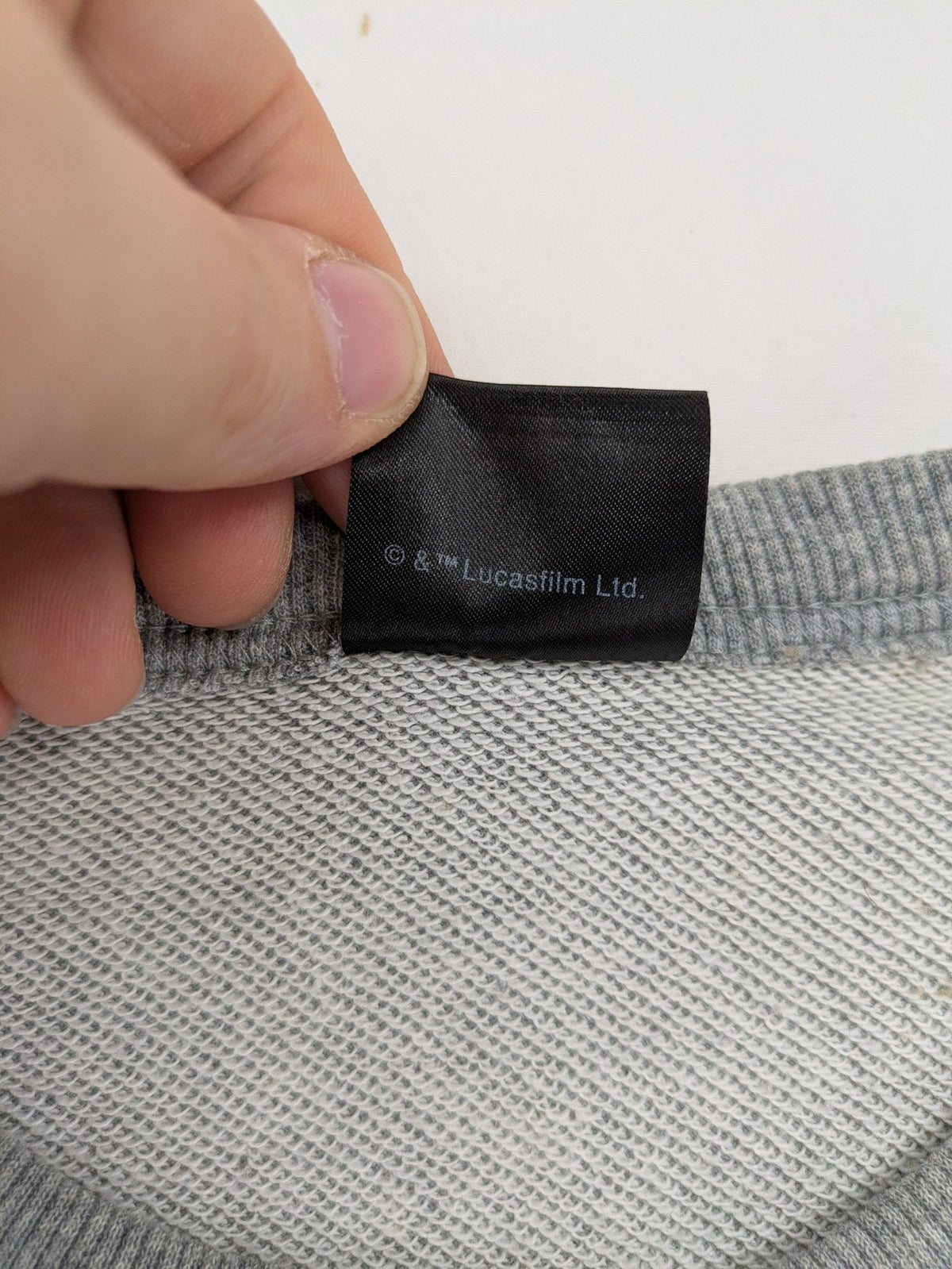 Star Wars grey short-sleeve sweatshirt with large cream logo print on chest.