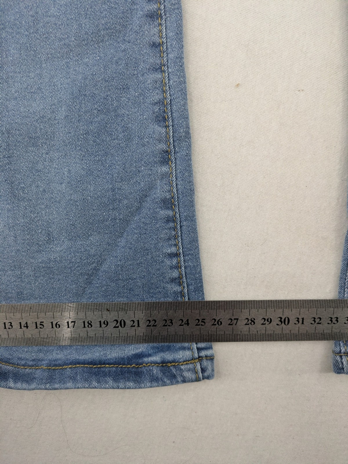 C&A blue bootcut jeans high waist stretch denim with double button closure.