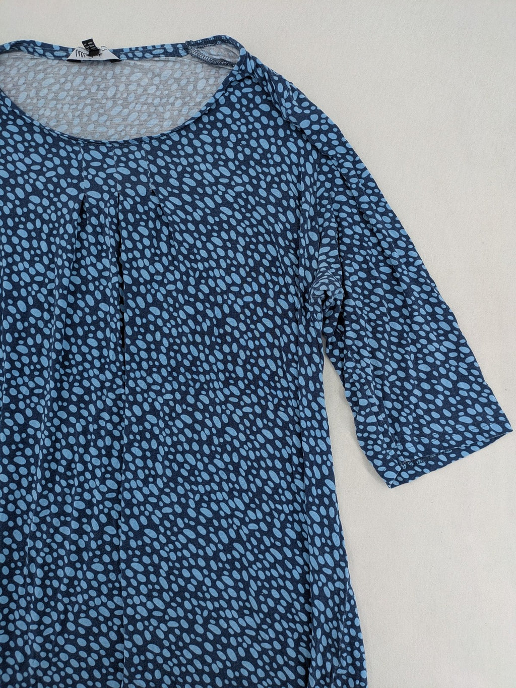 Ulla Popken blue tunic top with light blue polka dots and A-line cut.