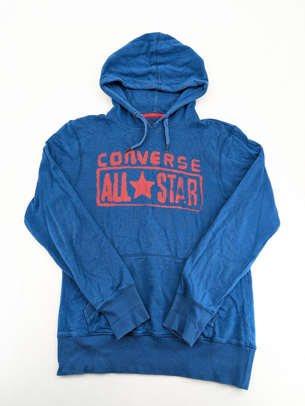 Converse All Star blue zip-through hoodie with red graphic logo and kangaroo pocket.