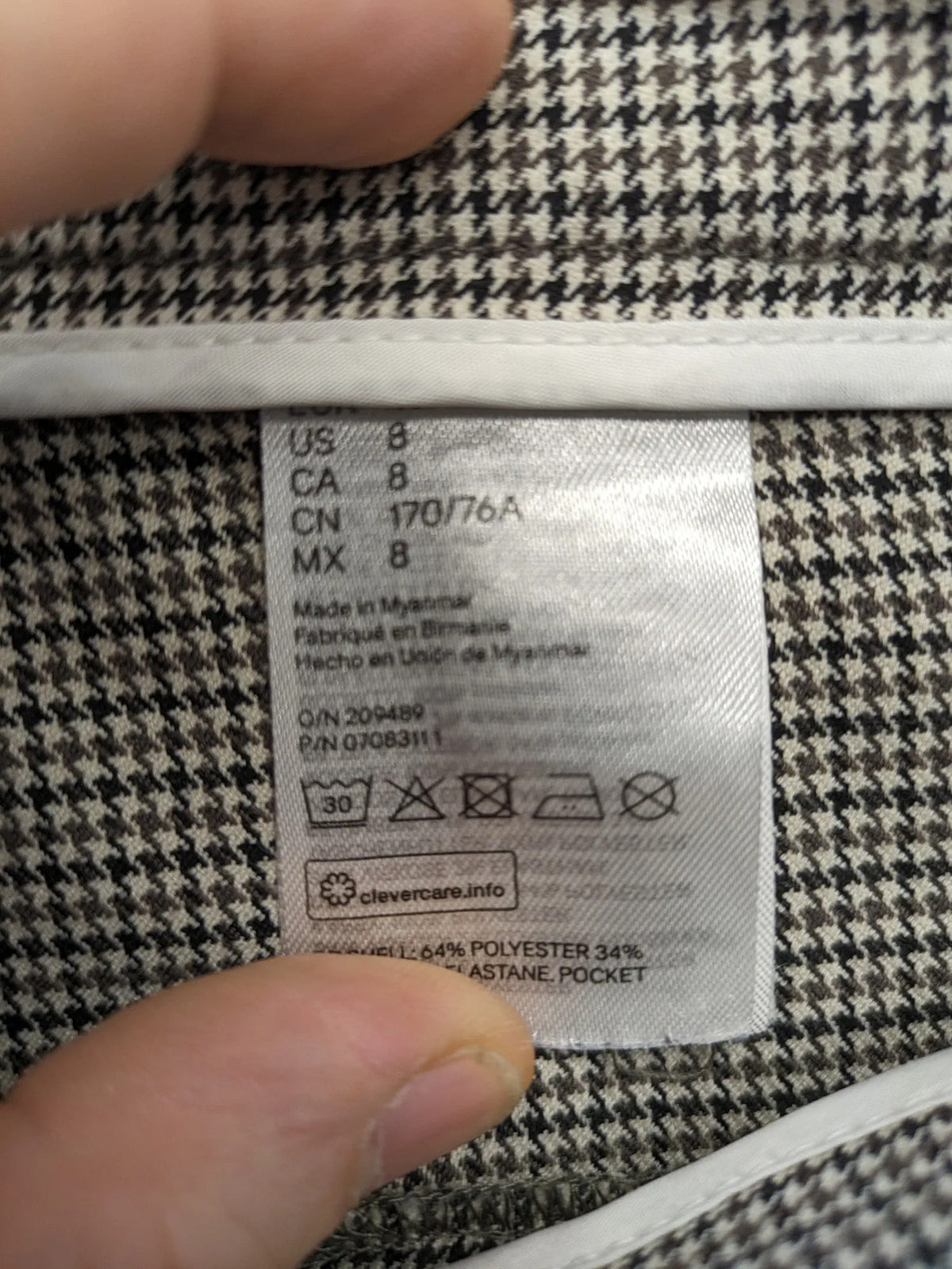 H&M beige pants houndstooth pattern with black and brown tones, stretchy material.