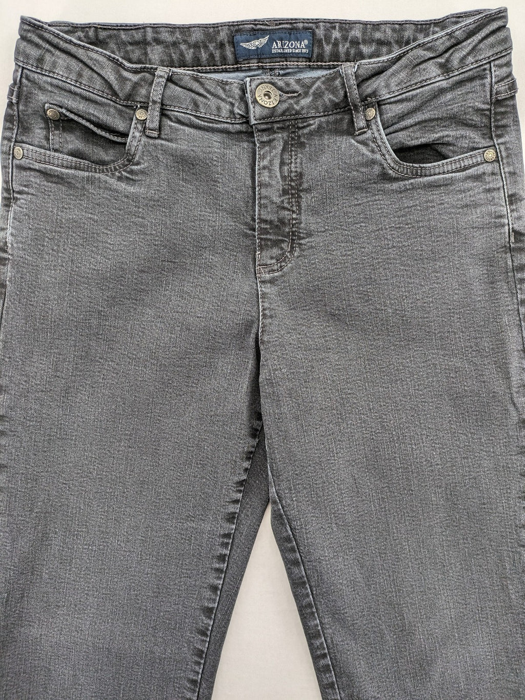 Arizona grey straight jeans with pearl-embellished wing appliqué on back pocket.