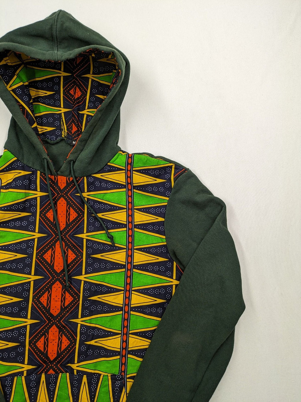 Diweye Creations multi turtle neck jumper with vibrant African print and soft green material.