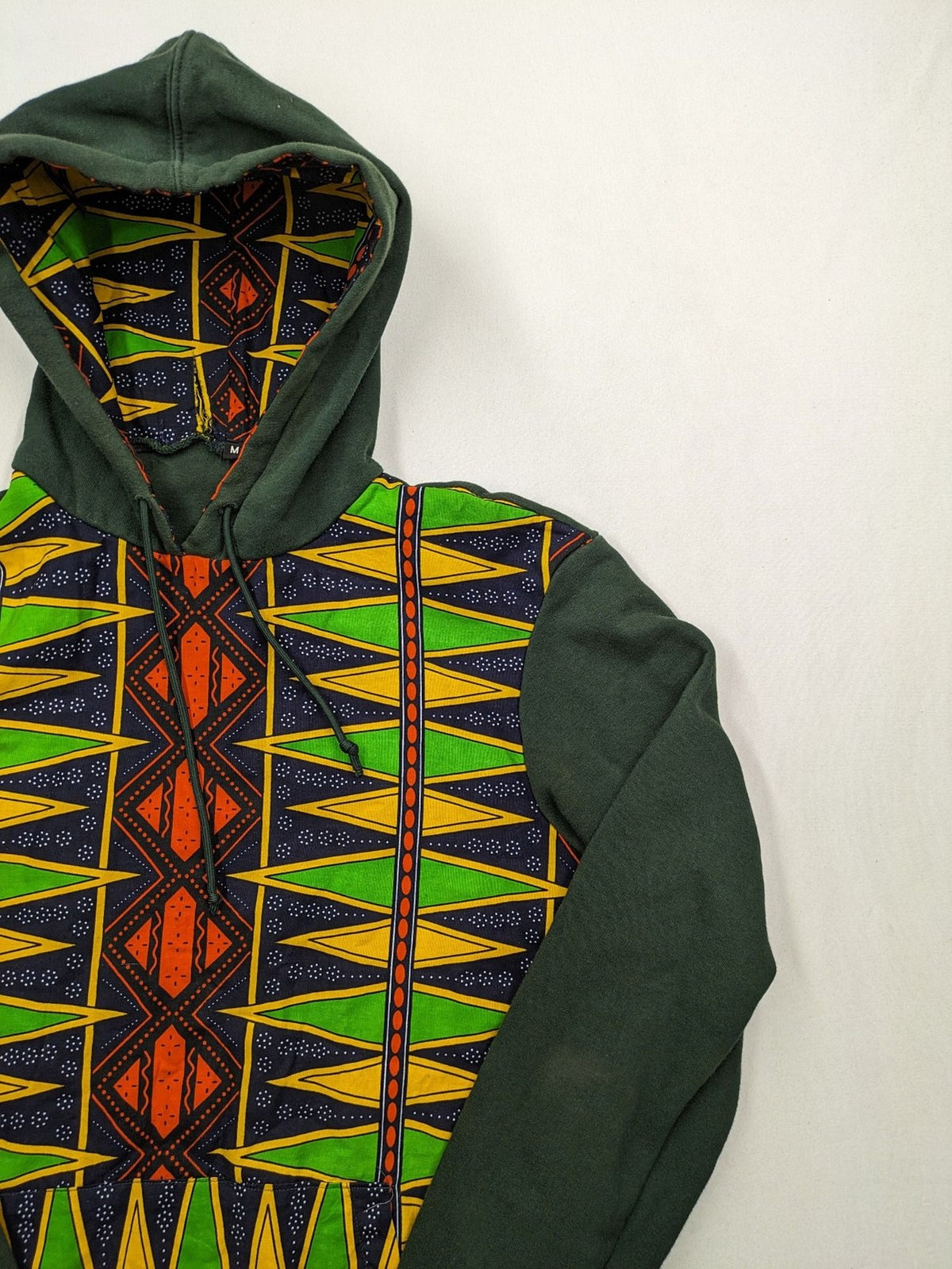 Diweye Creations multi turtle neck jumper with vibrant African print and soft green material.
