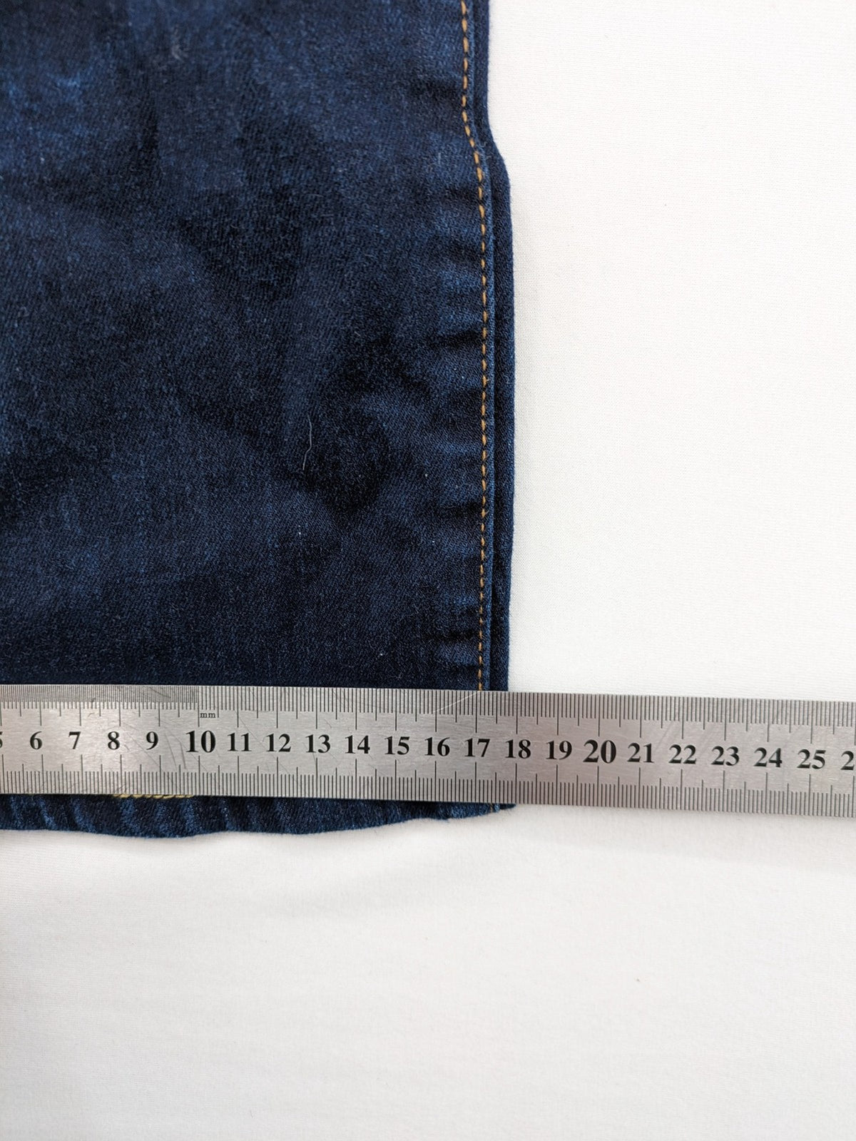 The Straight blue straight leg jeans with contrast stitching and 5-pocket design.