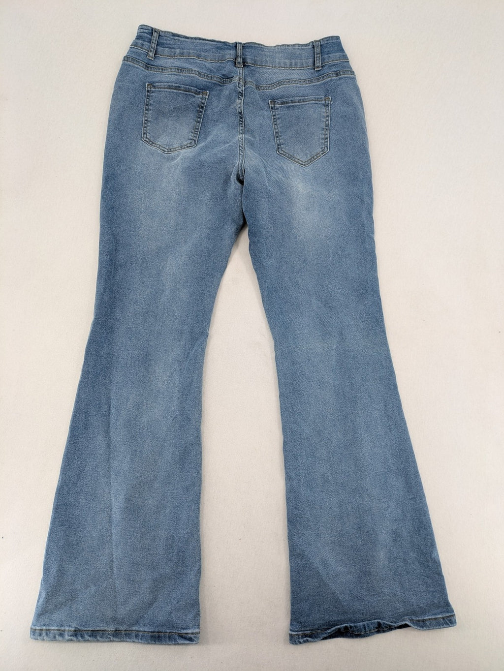 C&A blue bootcut jeans high waist stretch denim with double button closure.