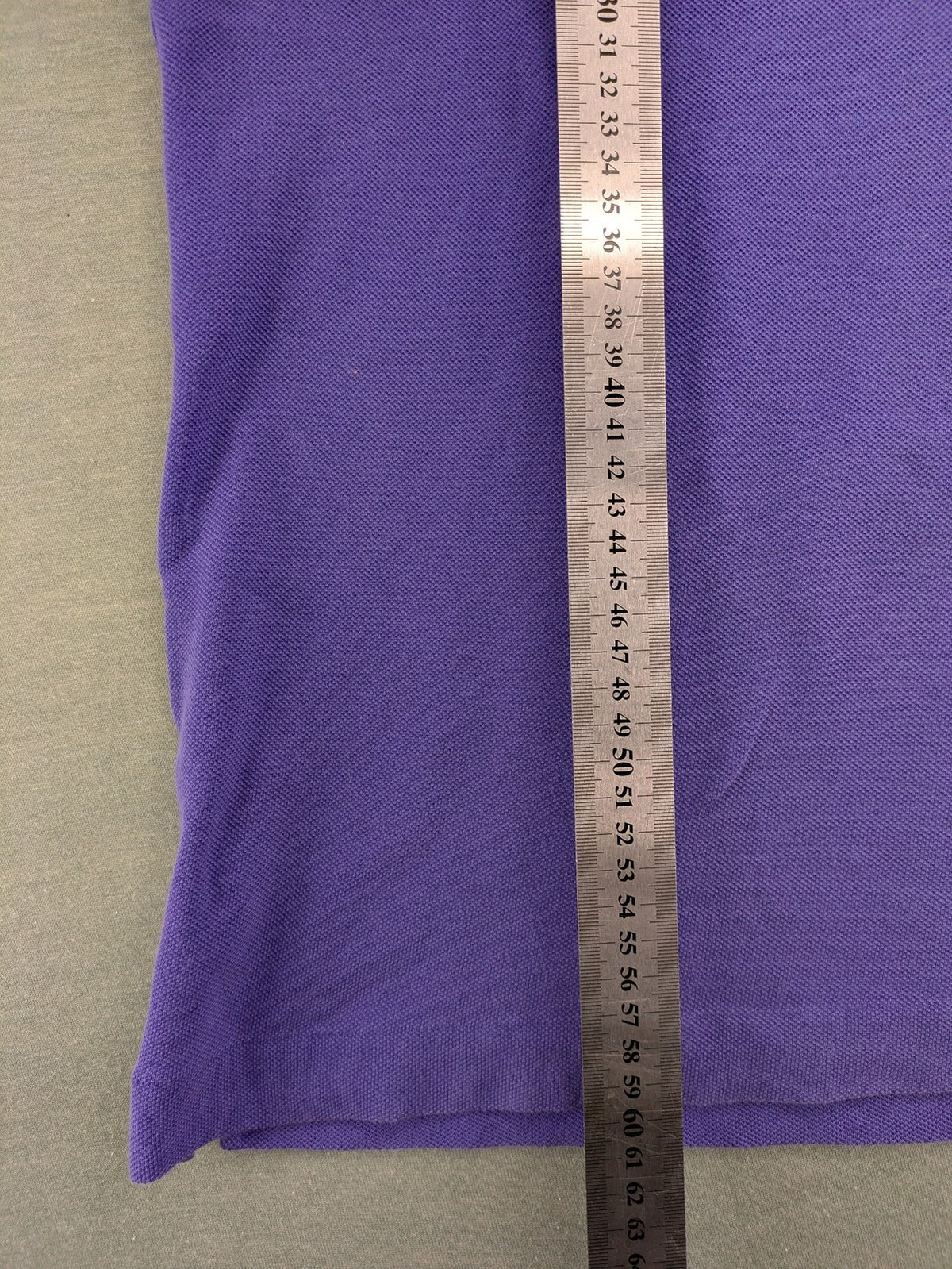 Lacoste purple polo shirt classic fit with embroidered crocodile logo and short sleeves.
