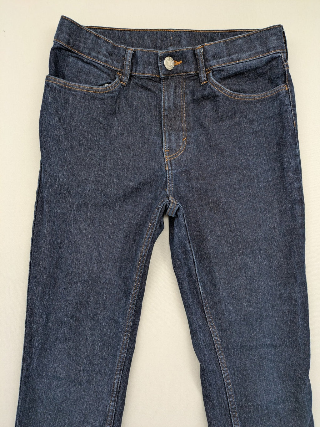 H&M blue skinny fit jeans with classic 5-pocket style and button closure.