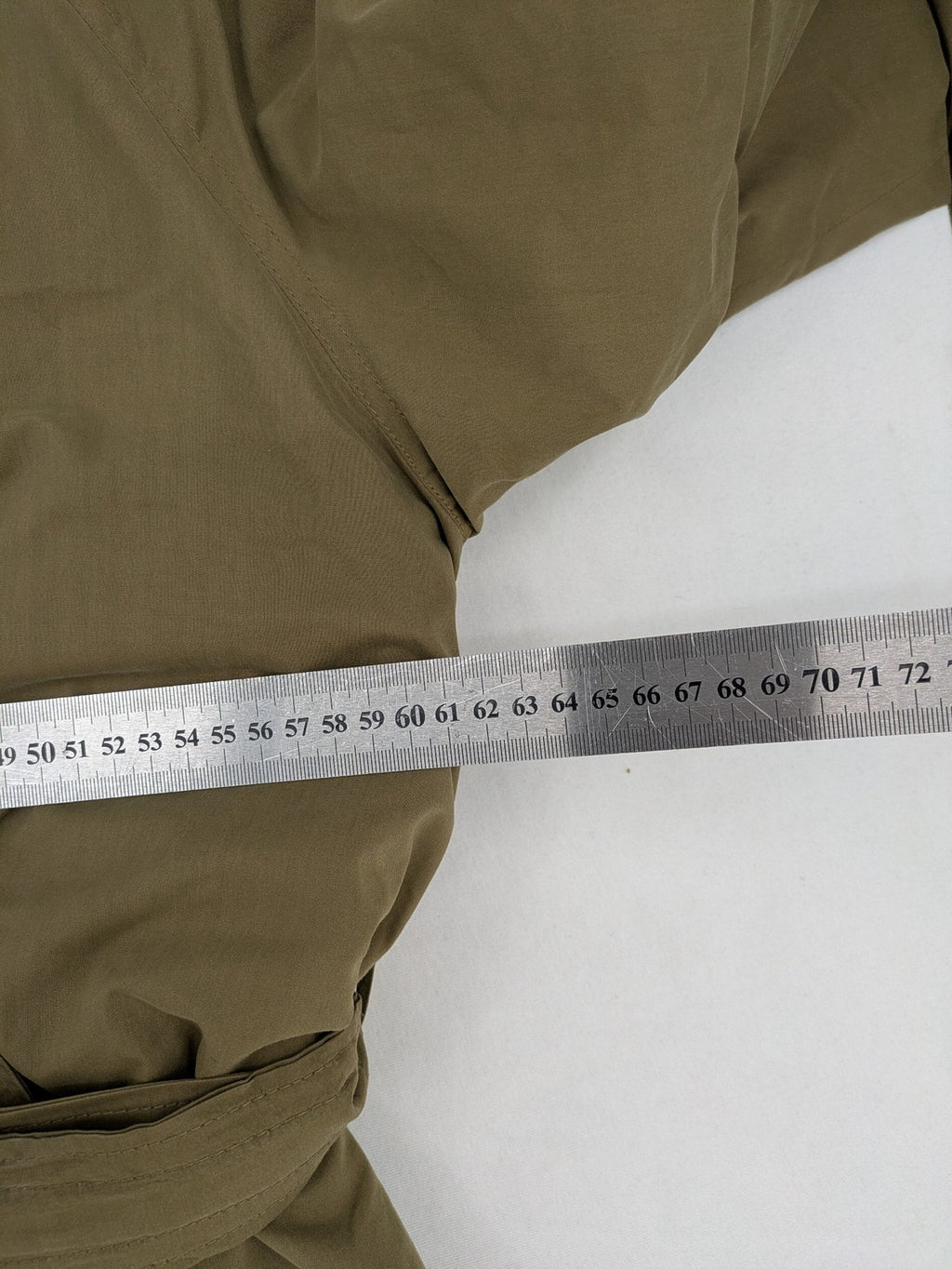 Studio Novum khaki trench coat double-breasted design with belt and wool lining.