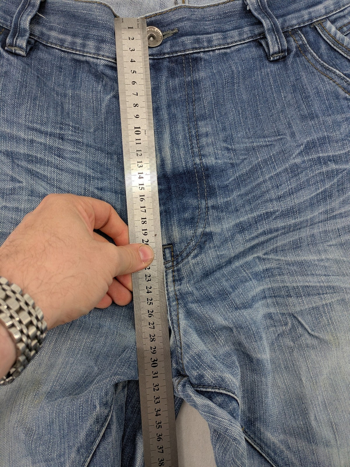 Premium Denim blue straight leg jeans with biker knee inserts and five-pocket design.
