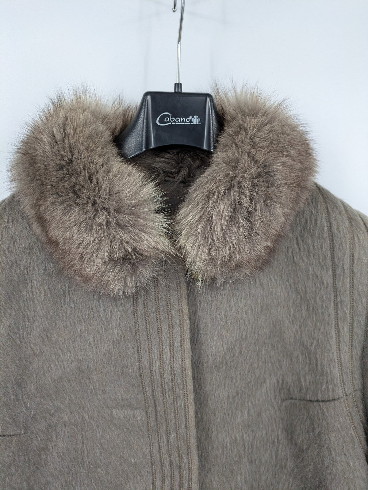 Lama brown vintage coat with fur collar, textured llama-mohair blend, elegant silhouette.