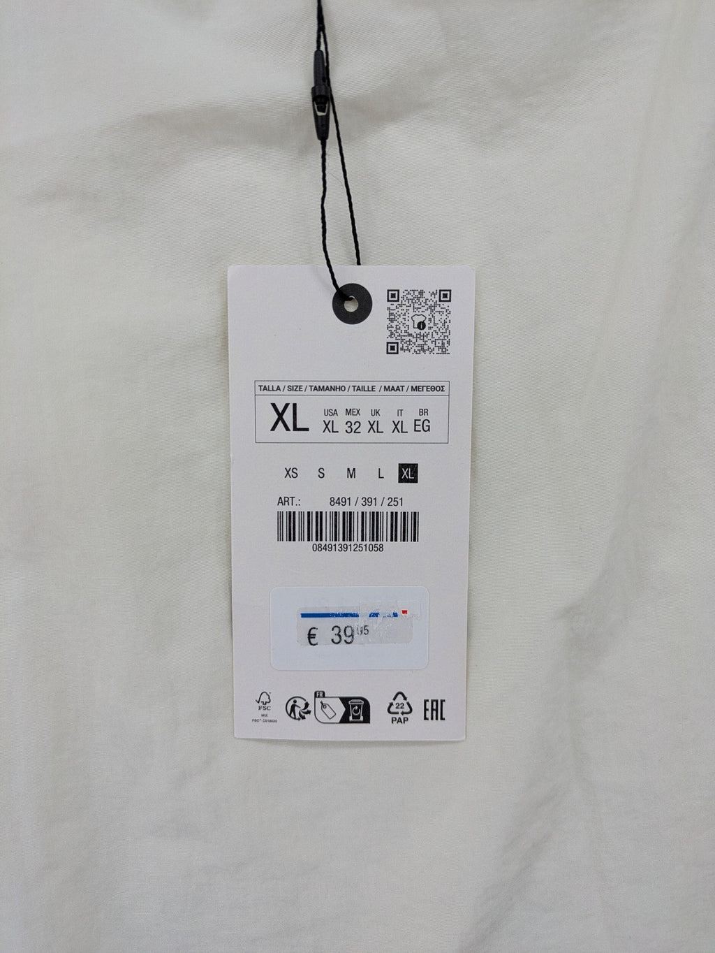 Zara cream tank top, sleeveless design, smooth polyamide fabric, minimalist style.