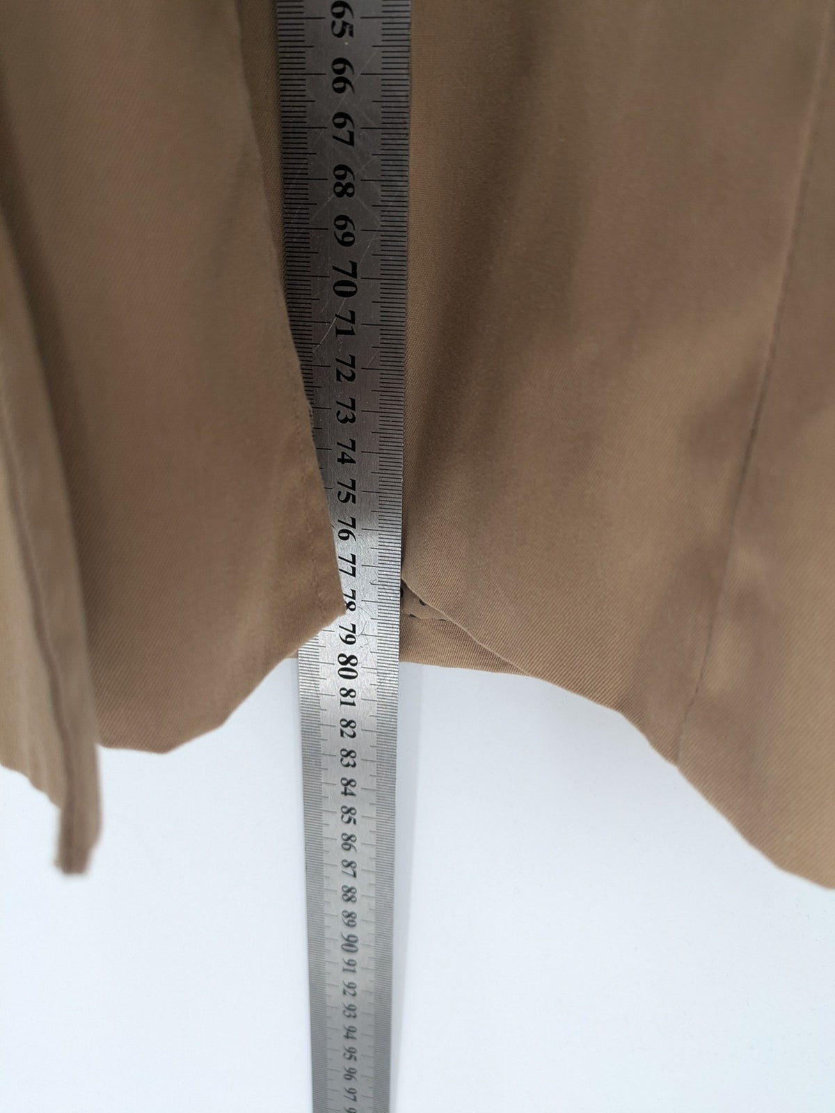 H&M Divided beige trench coat with button closure, hood, and polka dot lining.