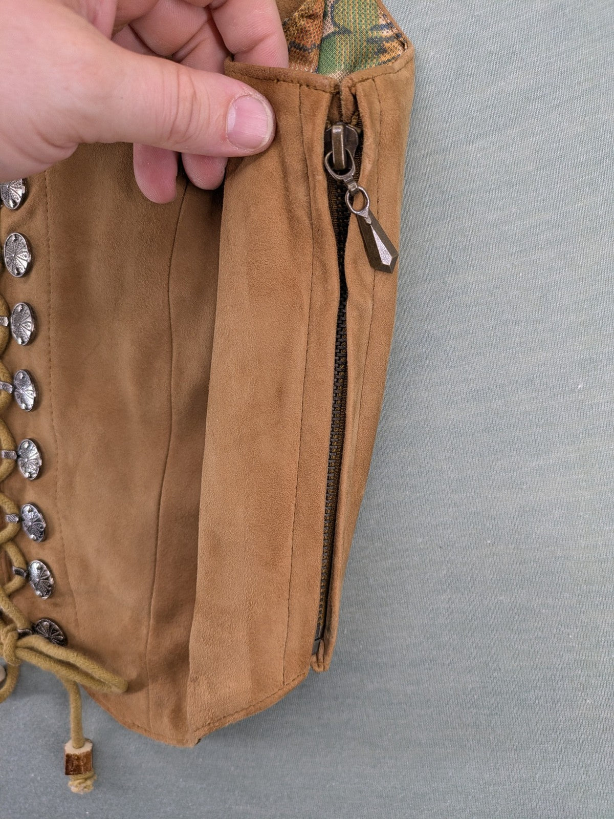 St. Moritz multi Trachtenweste brown genuine leather with decorative lacing and colorful satin lining.