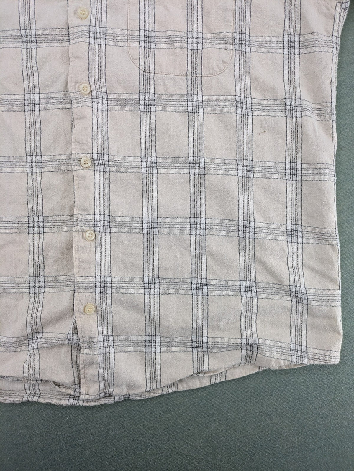 Ken Baker short-sleeve button-down shirt beige blue check pattern with single chest pocket.
