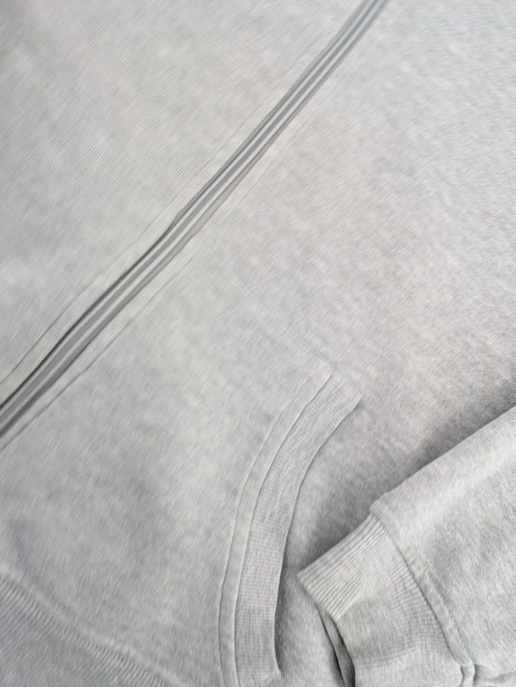 Primark grey zip-through hoodie featuring yellow Smiley logo and Nevermind graphic.