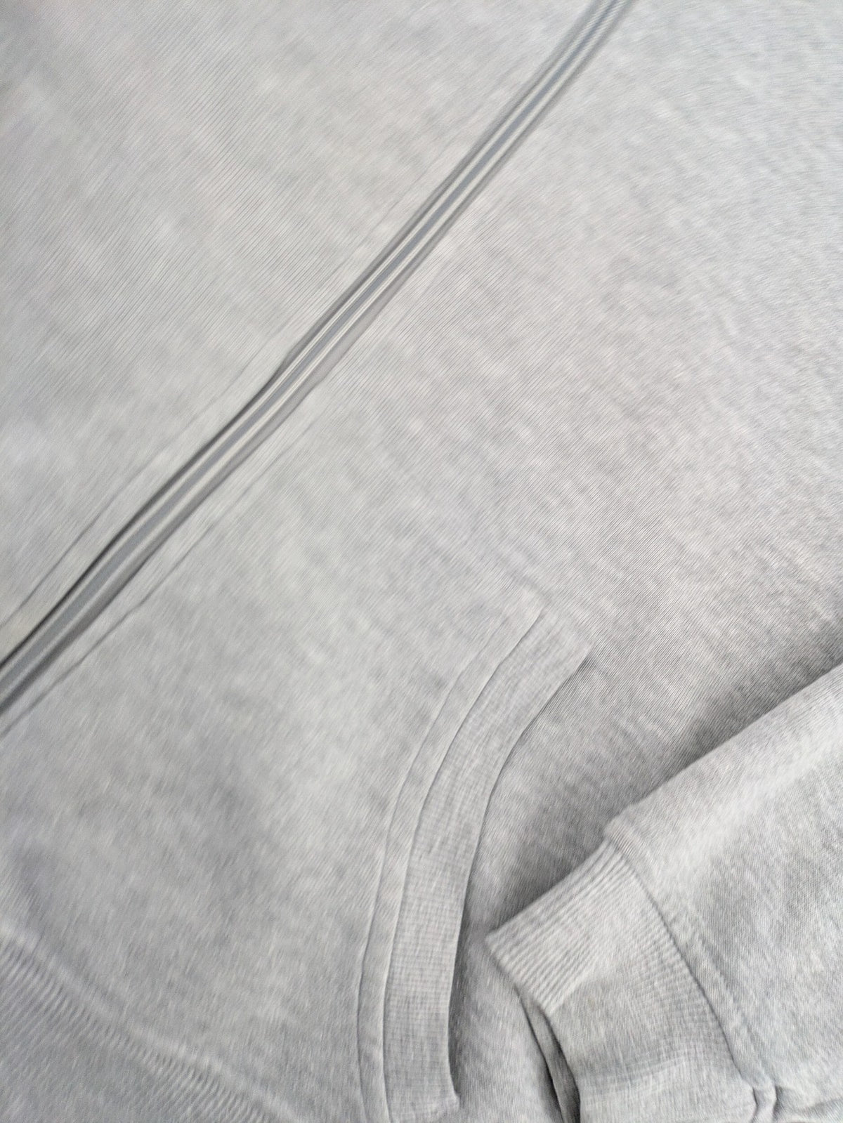 Primark grey zip-through hoodie featuring yellow Smiley logo and Nevermind graphic.
