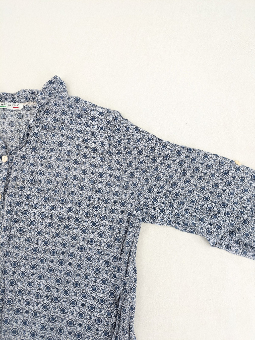 M/L blue and grey tunic top with geometric pattern and stand-up collar.