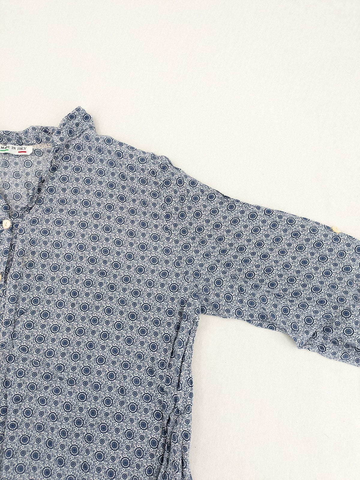 M/L blue and grey tunic top with geometric pattern and stand-up collar.