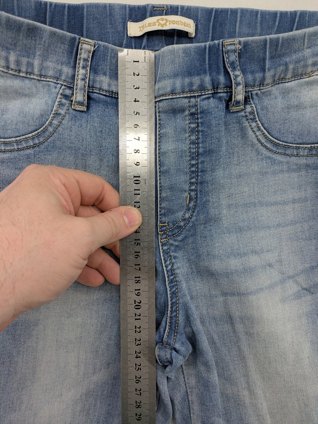 Miss Bonbon blue skinny jeans jeggings with elastic pull-on waistband and light wash.
