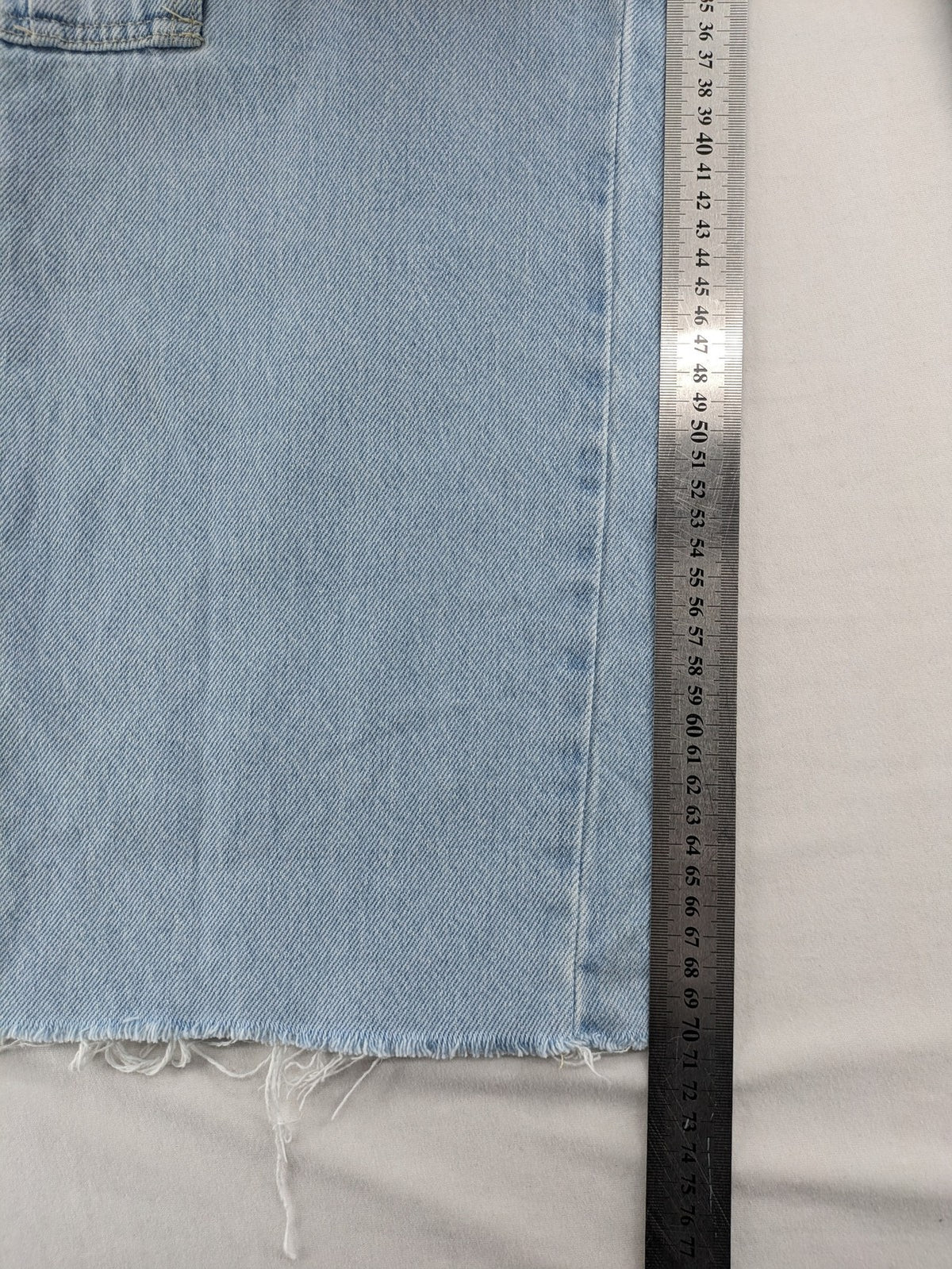 MNG blue straight jeans with cargo pockets and raw hem, high waist denim.