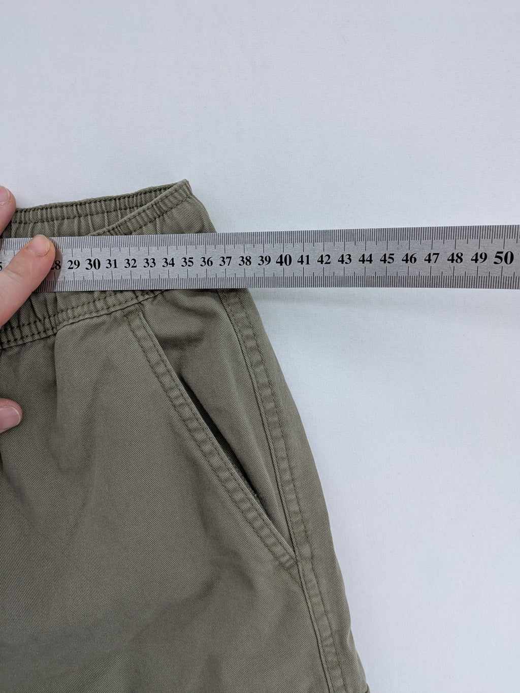 Y.F.K. khaki cargo pants with elastic cuffs, side pockets, and drawstring waistband.