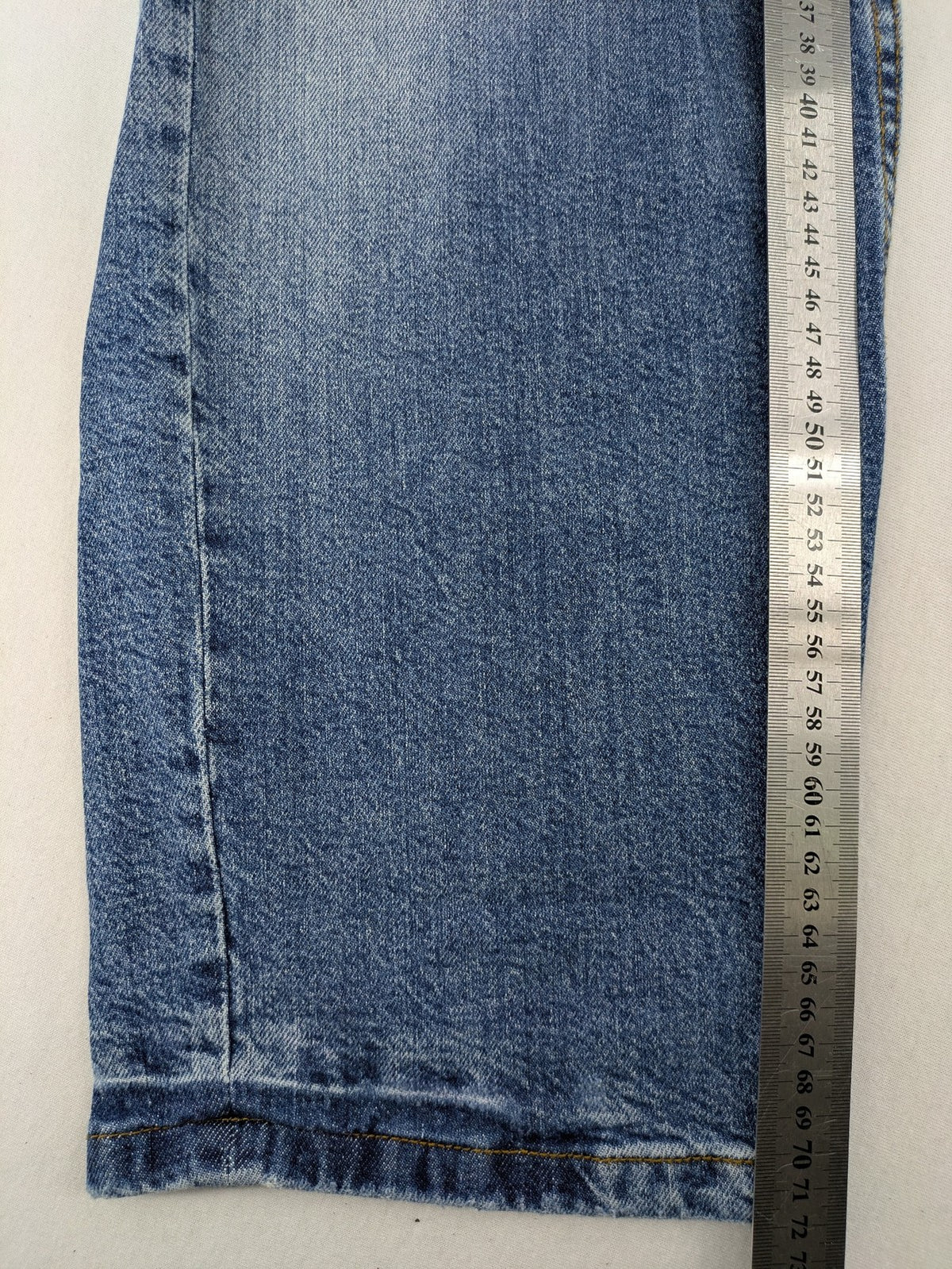 FSBN blue straight jeans with ripped distressed knees and classic button fly.
